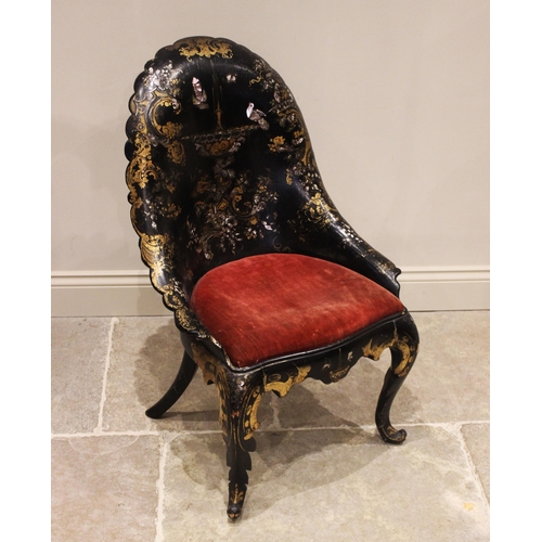 702 - A Victorian papier mache side chair, the arched back with a back swept scalloped rim, applied with g... 