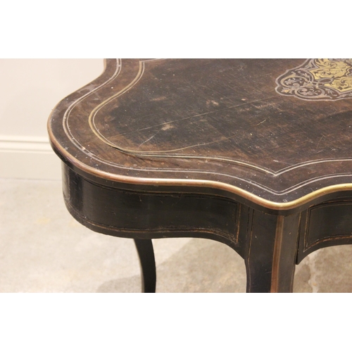 703 - A late 19th century ebonised and brass inlaid bureau plat/centre table, the serpentine shaped top ce... 