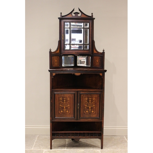 706 - A late Victorian rosewood freestanding corner display cabinet, the architectural pediment above a si... 