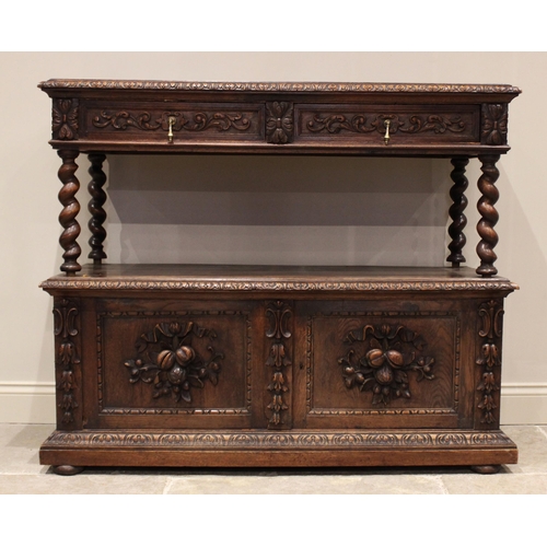 714 - A Victorian carved oak buffet, the upper tier with a pair of foliate carved frieze drawers, raised u... 