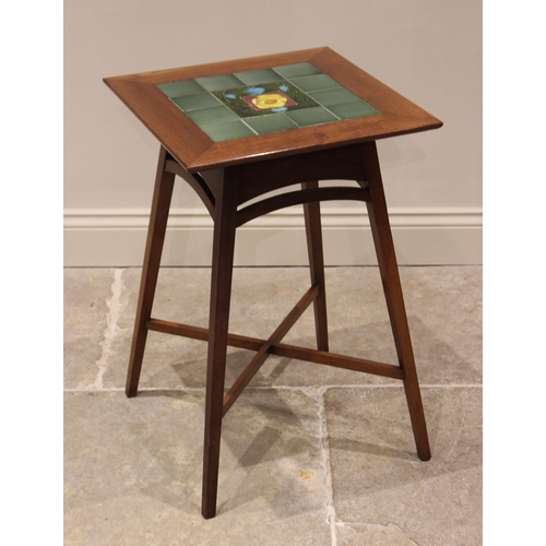 723 - A tiled top mahogany occasional table in the manner of Liberty, the square top centred with an Art N... 