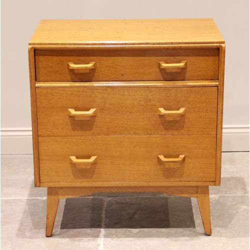 737 - A 1950's G-Plan 'Brandon' golden oak chest of drawers, formed from three long drawers, the upper dra... 