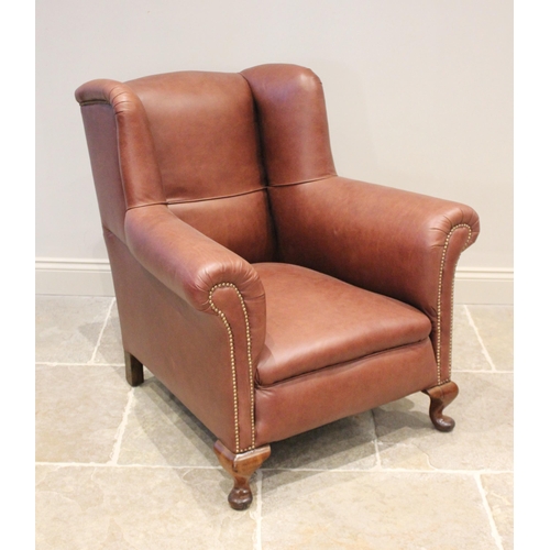 696 - A late 19th/early 20th century deep armchair in the manner of Howard & Sons, recently re-covered in ... 