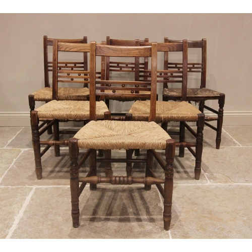 708 - A well matched set of six ash country chairs, early 19th century, each with a rail back punctuated w... 