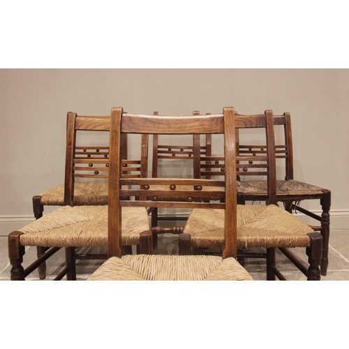 708 - A well matched set of six ash country chairs, early 19th century, each with a rail back punctuated w... 