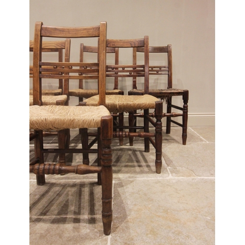 708 - A well matched set of six ash country chairs, early 19th century, each with a rail back punctuated w... 