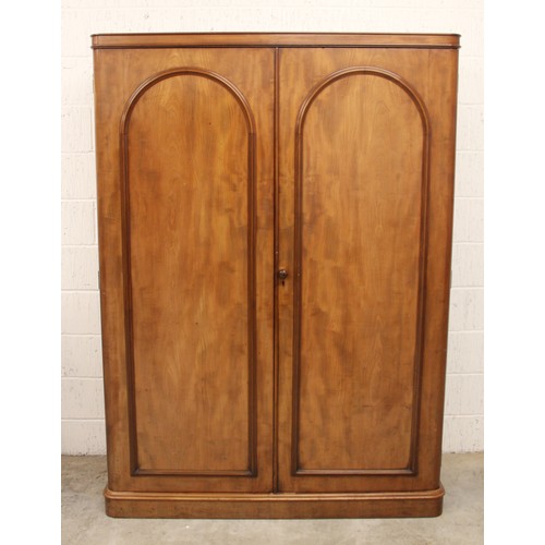 683 - A large Victorian mahogany wardrobe, the rectangular wardrobe designed with two cupboard doors appli... 