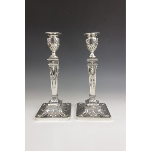 35 - A pair of George V neo-classical silver candlesticks, Ellis & Co, Birmingham 1914, each weighted squ... 