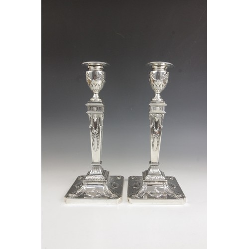 35 - A pair of George V neo-classical silver candlesticks, Ellis & Co, Birmingham 1914, each weighted squ... 