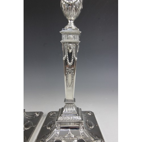 35 - A pair of George V neo-classical silver candlesticks, Ellis & Co, Birmingham 1914, each weighted squ... 