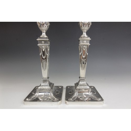 35 - A pair of George V neo-classical silver candlesticks, Ellis & Co, Birmingham 1914, each weighted squ... 