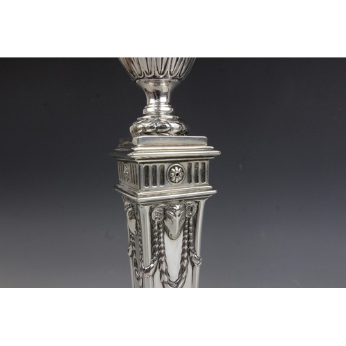 35 - A pair of George V neo-classical silver candlesticks, Ellis & Co, Birmingham 1914, each weighted squ... 