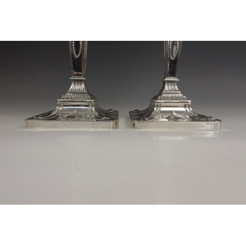 35 - A pair of George V neo-classical silver candlesticks, Ellis & Co, Birmingham 1914, each weighted squ... 