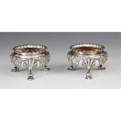 15 - A pair of silver open salts, R & S Garrard & Co, London 1912, each of circular form with gadroon bor... 