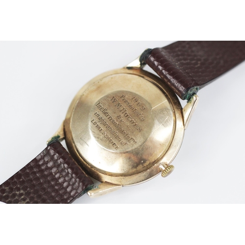 61 - A gentleman's vintage J.W. Benson Automatic 9ct gold wristwatch, the circular pearlescent dial with ... 