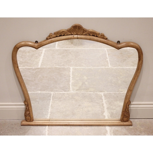 669 - A French style carved beech wood over mantel mirror, 20th century, the foliate crest above a shaped ... 