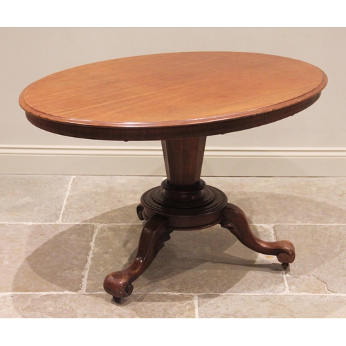 671 - A Victorian mahogany loo table, the moulded oval top raised upon an octagonal tapering column extend... 