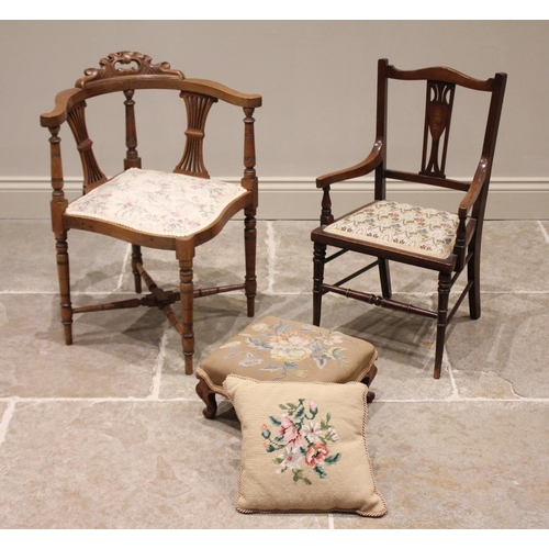 677 - A late Victorian walnut corner chair, with twin pierced splats above an upholstered seat, raised upo... 