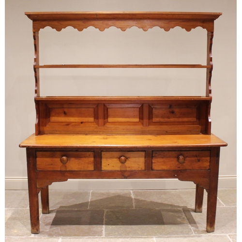 683 - A Victorian and later pine kitchen dresser, the associated rack with a moulded cornice and shaped fr... 