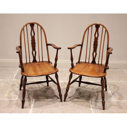 684 - A pair of ash, fruitwood and beech quaker elbow chairs, early 20th century, each with a hoop back an... 