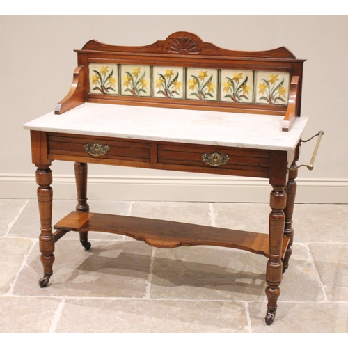 688 - A Victorian walnut marble top washstand, the shaped back enclosing a set of six Minton style daffodi... 