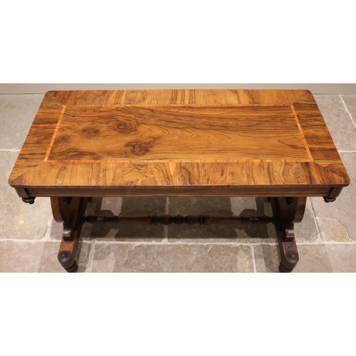 693 - A mid 19th century figured walnut side/occasional table, the rectangular crossbanded top above a pla... 