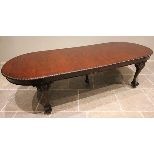 706 - A Chippendale revival mahogany dining table, circa 1920, the oval top with a gadrooned edge raised u... 