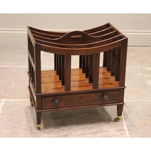 717 - An Edwardian mahogany Canterbury, with four divisions above a single frieze drawer, raised upon tape... 