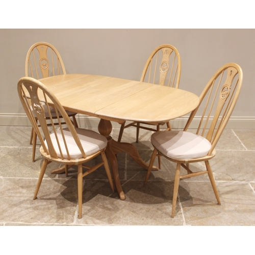 731 - An Ercol light elm and beech 'Chester' pedestal extending dining table with four Ercol chairs, late ... 