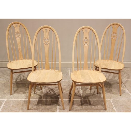 731 - An Ercol light elm and beech 'Chester' pedestal extending dining table with four Ercol chairs, late ... 