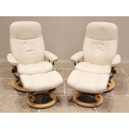 732 - A pair of Ekornes 'Stressless' reclining armchairs, in cream leather, with conforming footstools, la... 