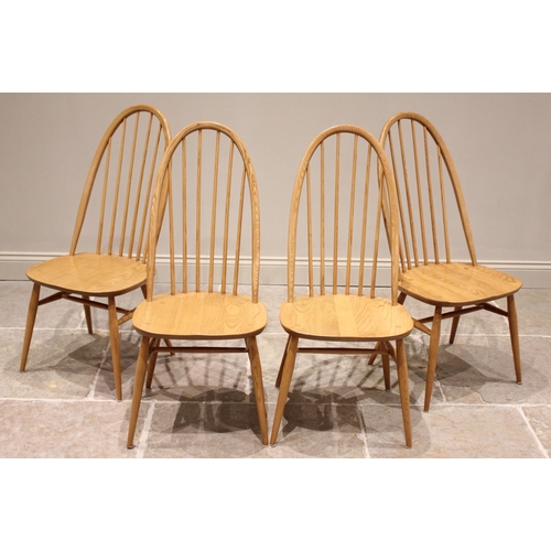 733 - An Ercol 'Chester' elm and beech extending oval pedestal table and four conforming Ercol chairs, the... 