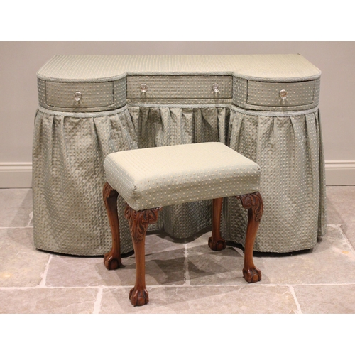 737 - A 1970’s upholstered inverted breakfront dressing table, the central frieze drawer uniting two cylin... 