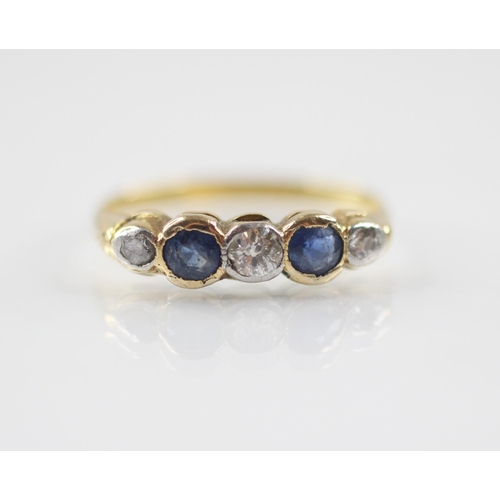 76 - An early 20th century sapphire and diamond five-stone ring, the central round old cut diamond weighi... 