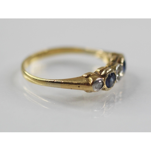 76 - An early 20th century sapphire and diamond five-stone ring, the central round old cut diamond weighi... 