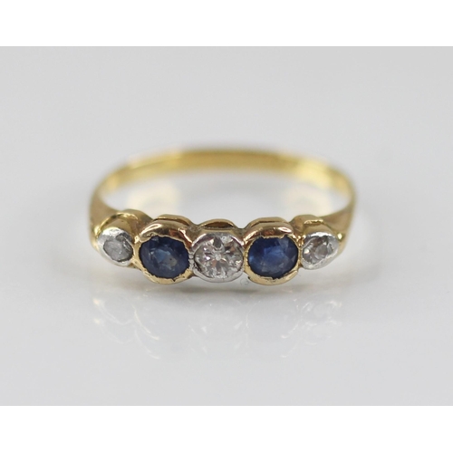 76 - An early 20th century sapphire and diamond five-stone ring, the central round old cut diamond weighi... 