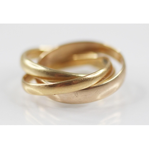 78 - A trinity ring, comprising three interlocking bands, one 18ct gold, marked for Birmingham 1929, one ... 