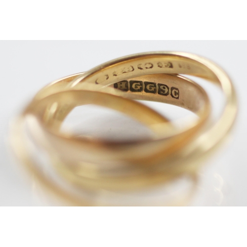 78 - A trinity ring, comprising three interlocking bands, one 18ct gold, marked for Birmingham 1929, one ... 