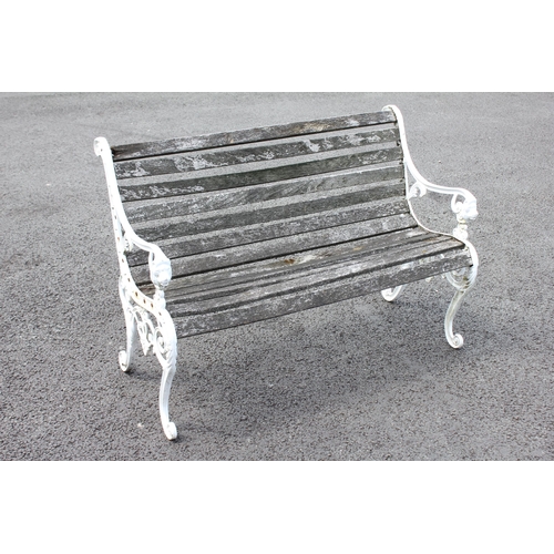 744 - A 19th century style painted metal and slatted hardwood bench, the supports cast with lion mask term... 