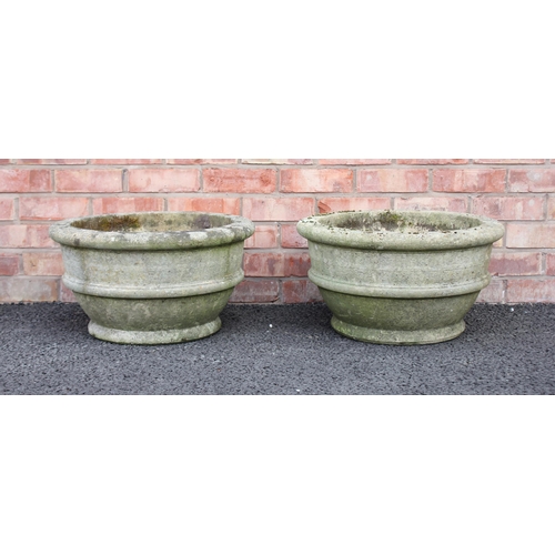 747 - A pair of reconstituted stone planters, of bowl form, cast with ribbed detail, 30cm H x 55cm D