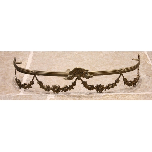 672 - A late 19th/early 20th century gilt metal rail or valance, the cast ribbon tied and reeded rail appl... 