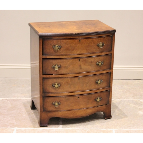 718 - A George III style figured walnut bow front chest of drawers, the book veneered top with a reeded ed... 