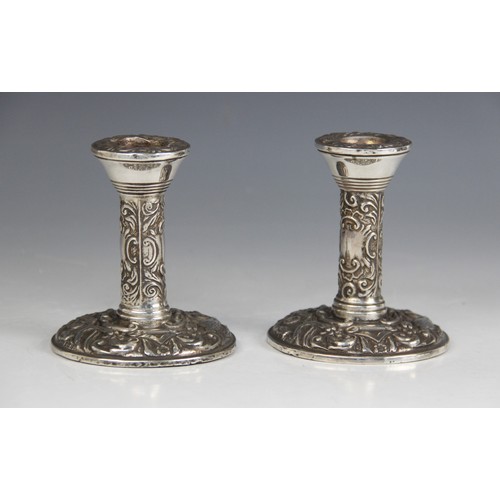 24 - A pair of silver mounted desk candlesticks, Broadway & Co, Birmingham 1967-68, cylindrical columns o... 