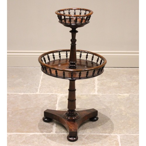 682 - A mid 19th century rosewood dumb waiter, the two graduated circular tiers with a spindle gallery, ra... 