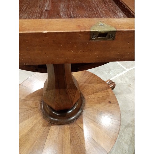 679 - A mid 19th century rosewood pedestal breakfast table, the circular tilt top raised upon an octagonal... 