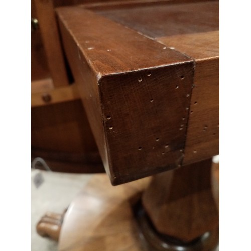 679 - A mid 19th century rosewood pedestal breakfast table, the circular tilt top raised upon an octagonal... 