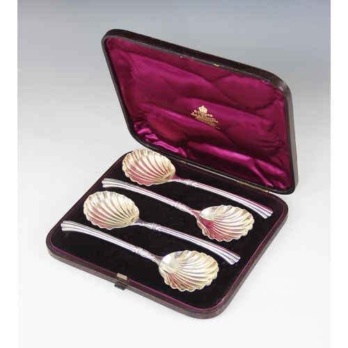 100 - A cased set of four Victorian silver serving spoons, Francis Higgins III, London 1882, each with she... 