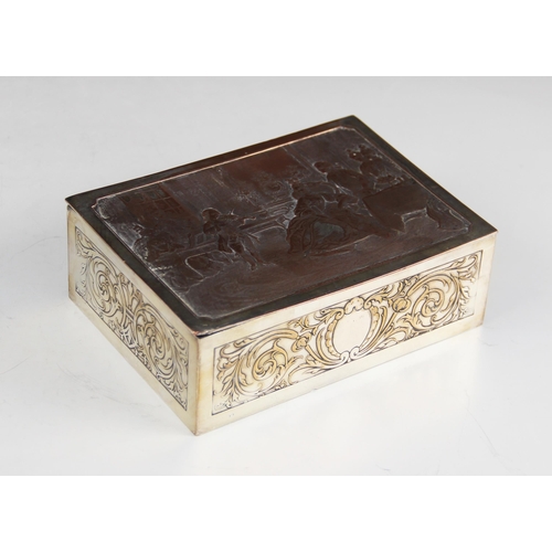 107 - A silver plated jewellery casket, of rectangular form, the cover depicting Wofang Amadeus Mozart pla... 