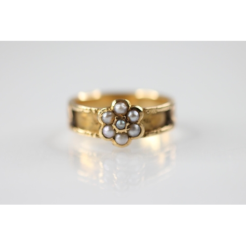 113 - A 19th century pearl set memorial ring, designed as a floral cluster set with half pearls, set upon ... 