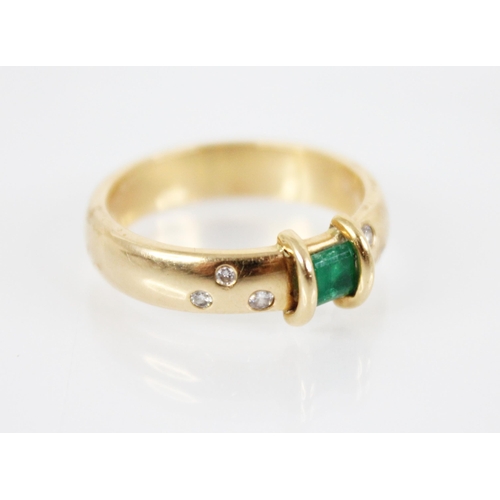 124 - An emerald and diamond ring, the central rectangular step cut emerald measuring 3.8mm x 4.8mm, to an... 